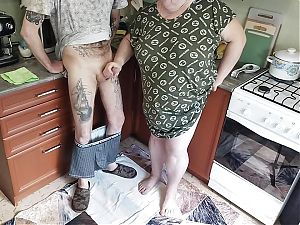 a fat woman jerks off my dick in the kitchen and I cum powerfully